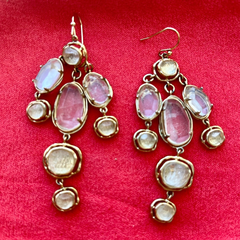 Dangling gold tone earrings with clear crystals